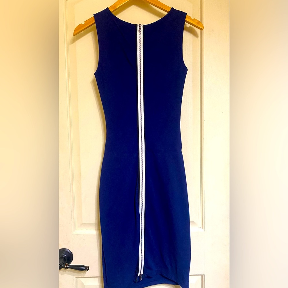 Full length zipper in the back, zipper at top and bottom